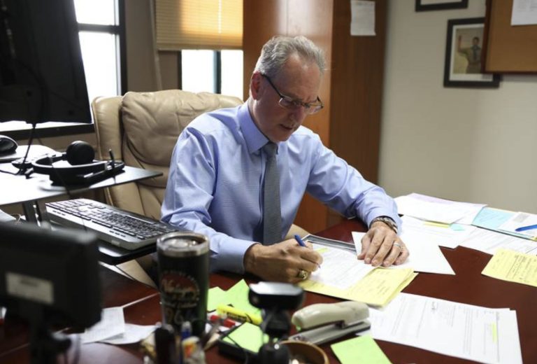 Joliet attorney Frank Andreano makes notes on a document in his office on Thursday, May 16, 2024. Andreano is raising a constitutional challenge to Illinois civil asset forfeiture law. He claims prosecutors in Will County have been engaging in "prosecuting for profit" with forfeiture cases, which is in violation of the Illinois and U.S. constitutions. Will County State's Attorney James Glasow's office disputes those allegations. (Gary Middendorf)